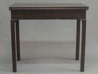 A Georgian mahogany card table raised on square supports 33"