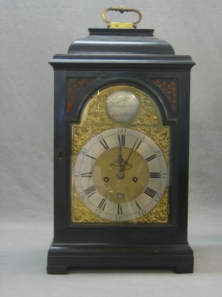 An 18th Century fusee striking bracket clock with 5 1/2" engraved back plate, striking on bell, the 8" arch shaped dial with gilt metal spandrels, silvered chapter ring and calendar aperture by Samuel Whichcote of London contained in an ebony case