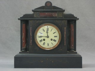 A Victorian 8 day striking French mantel with enamelled dial having Roman numerals, contained in a 2 colour marble case