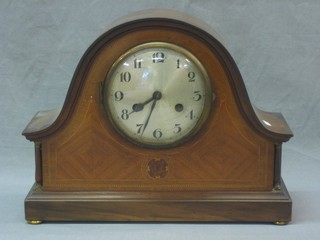 An Edwardian 8 day mantel clock with silvered dial and Roman numerals contained in an inlaid mahogany arch shaped case 14"