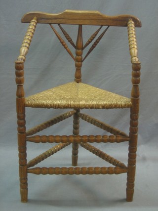 An elm and bar back Turners chair with bobbin turned decoration and triangular shaped seat