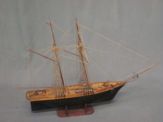 A wooden model of a 3 masted ship 19"