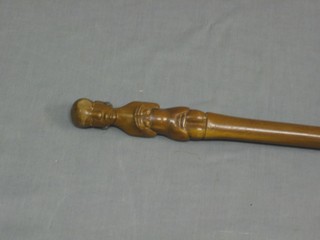 A carved Eastern walking stick