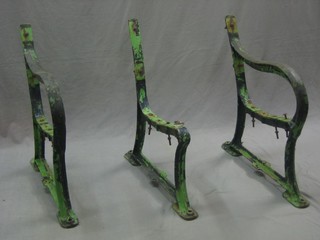A pair of iron garden bench supports