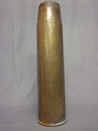 A large brass shell case for a 3.5 gun 25"
