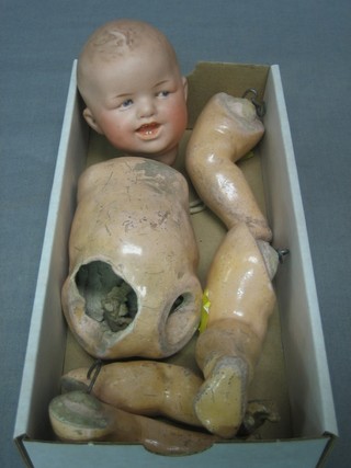A porcelain headed doll (f)