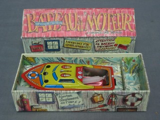 A Chinese candle powered tin plate model motor boat, boxed