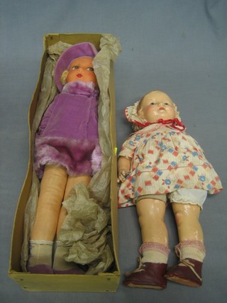 A Deans fabric doll together with a plastic doll