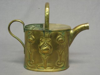An Art Nouveau oval embossed brass hotwater carrier (lid f), the base marked J S & S B