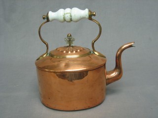 A Victorian oval copper kettle with ceramic handle