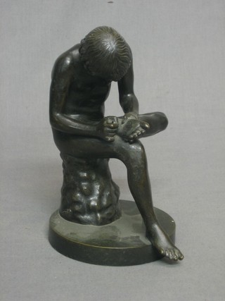 After the antique, a bronze figure of a seated boy removing at thorn from his foot 7"