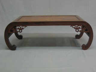 An Eastern Padouk wood coffee table with pierced panels to the side and figured panel to the centre 35"