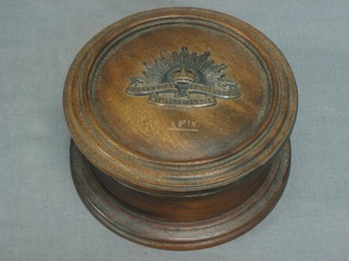 A cylindrical wooden trinket box the lid decorated the badge of the Australian Commonwealth Military Forces 5"