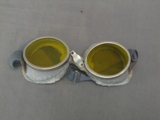 A pair of yellow tinted motorcycling goggles