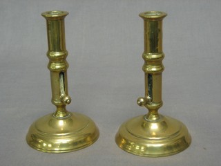 A pair of 19th Century brass candlesticks with ejectors 6 1/2"