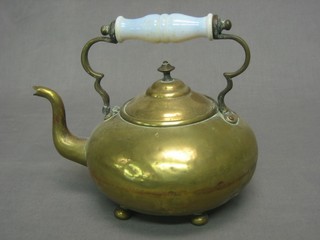 A 19th Century brass kettle with opaque glass handle 10"
