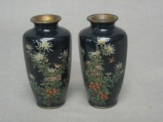 A pair of 19th/20th Century black ground cloisonne vases decorated birds amidst branches (some chips) 4 1/2"