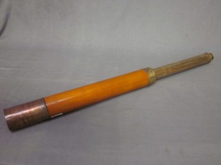 A wooden and brass single draw day night telescope by Doland of London complete with leather carrying case