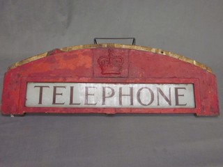 An arched section of red GPO telephone box with Queens Crown and brass plate marked telephone 32"