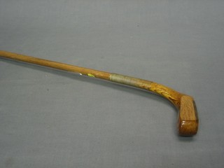 A hickory shafted putter, the head marked Made in St Andrews by Golf Classics