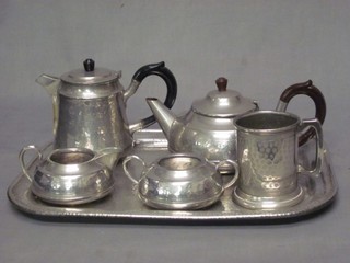 A rectangular heavy planished pewter tray 16", a Cameo planished pewter 3 piece tea service comprising teapot, twin handled sugar bowl and cream jug, a Roundhead pewter hotwater jug and an English pewter tankard