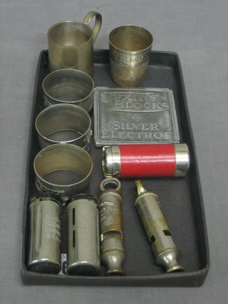 2 Metropolitan patent Police whistles, 2 Magic saving banks, 1 other, 2 silver plated spirit measures, 3 silver plated napkin rings and 1 other item