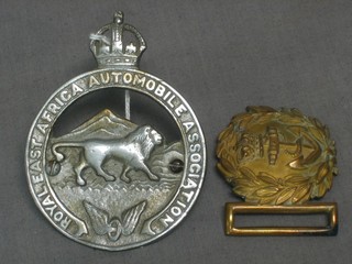 A Royal East African Automobile Club badge and a Victorian Royal Naval Officer's belt buckle