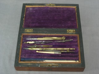 A 19th Century part geometry set contained in a rosewood box with hinged lid