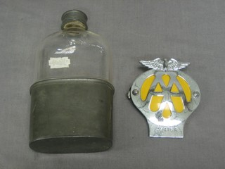 A glass hip flask with detachable pewter cup and an AA Beehive badge no.39416A