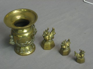 An Eastern brass twin handled vase 5" and 3 Eastern weights