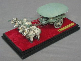 A bronzed model of a horse drawn carriage, marked 20th Century Congress of Icold Beijing 9", cased