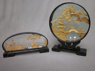 An Eastern carved cork sculpture contained in a circular frame 11" and 1 other in an oval frame 13"