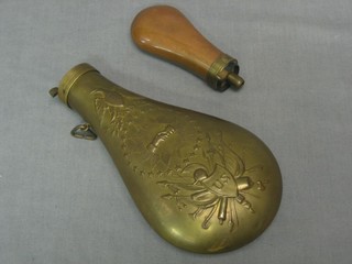 A copper powder flask 4" and a brass powder flask 8"