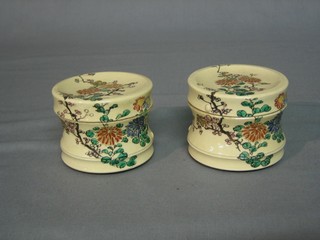 A pair of Japanese Satsuma cylindrical jars and covers, the lid with impressed mark (some chips to rim) 2 1/2"