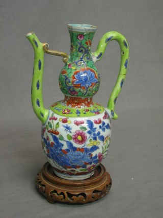 An Oriental porcelain double gourd shaped teapot (chip to base, f and r) 8"