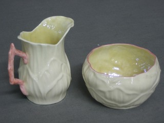 A Beleek cream jug and sugar bowl, the base with black Beleek mark 3"