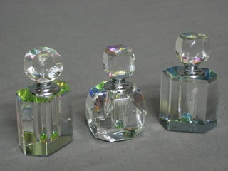 A pair of lozenge shaped glass scent bottles 2 1/2" and a square ditto 2 1/2" 