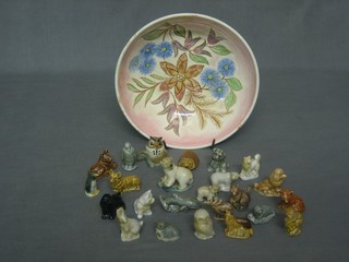 A circular floral pottery bowl 8" containing 24 Wade Whimsies