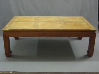 A rectangular Eastern hardwood opium style coffee table with brass banding 59"