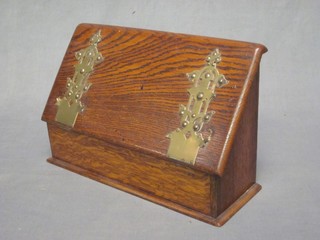 A Victorian oak stationery box with fall front revealing a fitted interior 12"