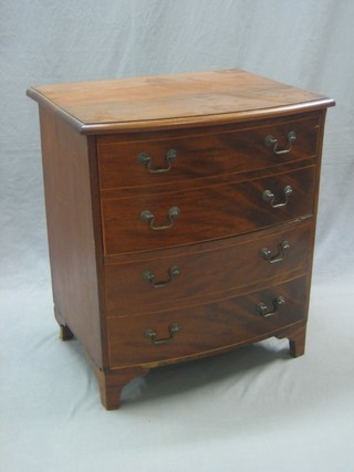A Victorian mahogany bow front chest commode with hinged lid, raised on bracket feet 25"