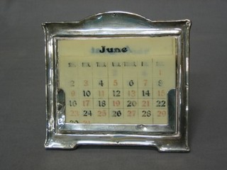 A silver easel framed perpetual calendar with 12 sheet months and 7 permutations of dates, Birmingham 1919