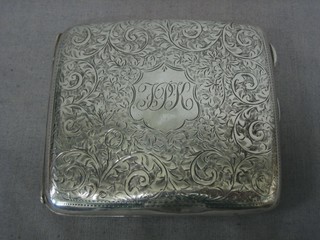 A silver cigarette case with engraved decoration Birmingham 1912, 3 ozs