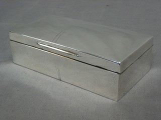 A plain silver cigarette box with hinged lid, Chester 1899 7"