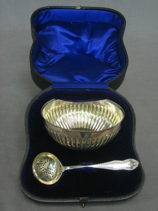 circular silver bowl with demi-reeded decoration Birmingham 1924, together with a sifter spoon Birmingham 1900, 4 ozs, cased