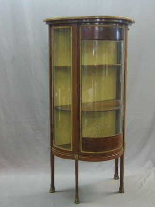 A bow front Kingwood Vitrine with gilt mounts throughout, raised on square tapering supports 27"