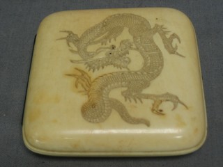 A carved ivory cigarette case, carved a dragon, the reverse signed 3"