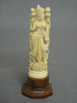A carved ivory figure of a standing Deity 5"