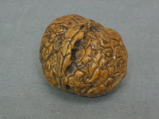 An Oriental carved walnut decorated figures 1"