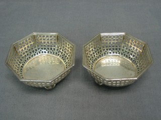 A pair of octagonal pierced silver bowls raised on scrolled feet Birmingham 1919, 3 ozs